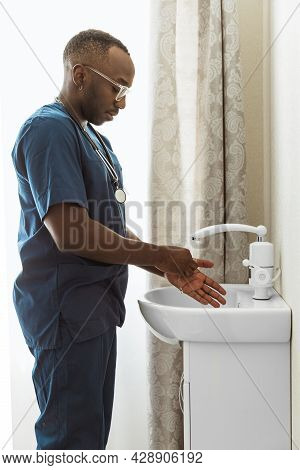Close-up Portrait Of African Young Doctor, Therapeutic Or Medical Advisor At Work, Idoors . Concept 