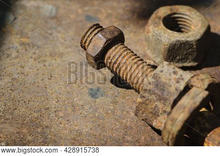 Rusty Nut. Rusty Iron Rod With Screw Threads. Rusted Mechanical Components. Threaded Bolt And Nut Is