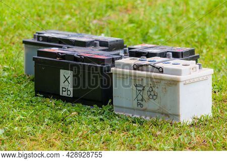 Pb Lead Car Batteries On A Grass In The Nature