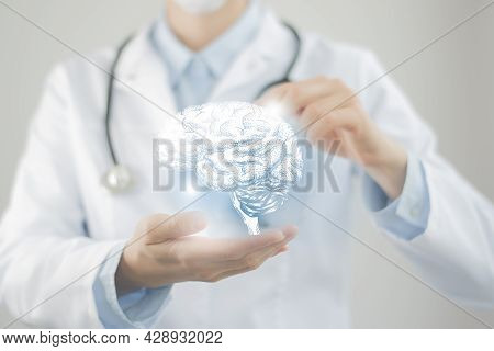 Female Doctor Holding Virtual Brain In Hand. Handrawn Human Organ, Copy Space On Right Side, Raw Pho