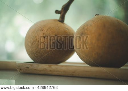 Santol Fruits On A Wood Tray, Santol Has A Sour Taste And The Middle Of Santol Is Sweeter. It Is A V