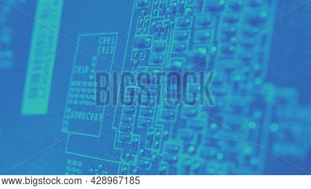 Semiconductor. Cpu Chip Located On The Green Motherboard Of The Computer.