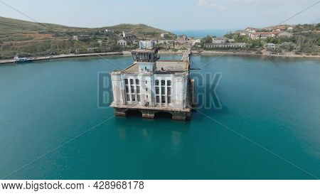 Abandoned Factory With Pier On Coast. Shot. Beautiful Pier With Abandoned Factory Building Or Fishin