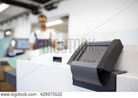 Computer To Plate Machine And Operator In Printing Shop.