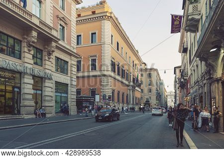 Rome, Italy - October 2019: Old Classic Buildings And People Walking Along The Street Of Via Del Cor