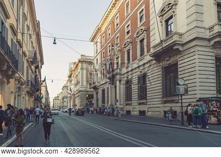 Rome, Italy - October 2019: Old Classic Buildings And People Walking Along The Street Of Via Del Cor