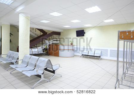 Spacious room with a seating area, the reception and staircase