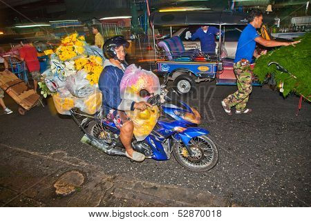 People Transport Flowers At Pak Khlong Thalat Market