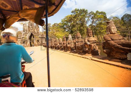 SIEM REAP, CAMBODIA - DEC 13: Unidentified cambodian moto-rickshaws in Angkor Wat, Dec 13, 2012 on Siem Reap, Cambodia. Angkor is the country's prime attraction for visitors.