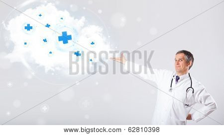 Proffesional doctor listening to abstract cloud with medical signs
