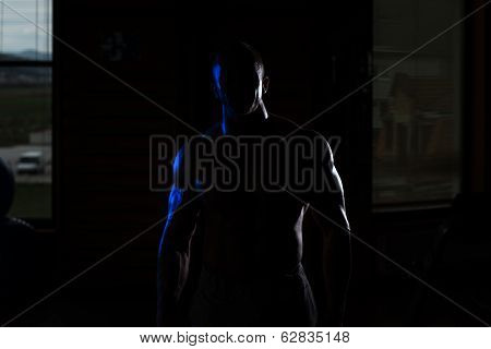 Siluet Young Muscular Man Flexing Muscles