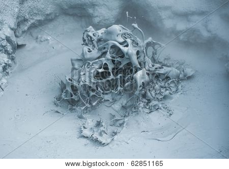 Hot boiling mud at fumarole is bubbling and exploding at mudpots, Hverir - Icelnad. When photographed at high speed nice sculptures could be seen