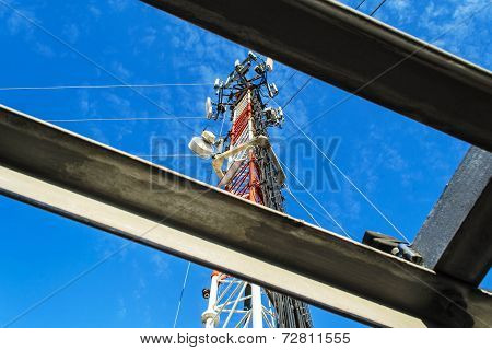 High Mast Metal Structure Telecommunication On Tower With Blue Sky.