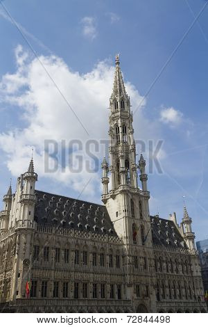 Brussels Town Hall, Grand Place, Belgium. Clouds And Blue Sky.