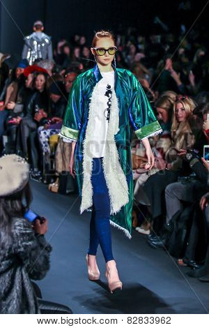NEW YORK - FEBRUARY 13: A model walks the runway at the Mongol Fall/Winter 2015 collection during Mercedes-Benz Fashion Week in New York on February 13, 2015.