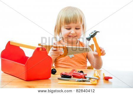 cute little kid with toy tools isolated on a white background