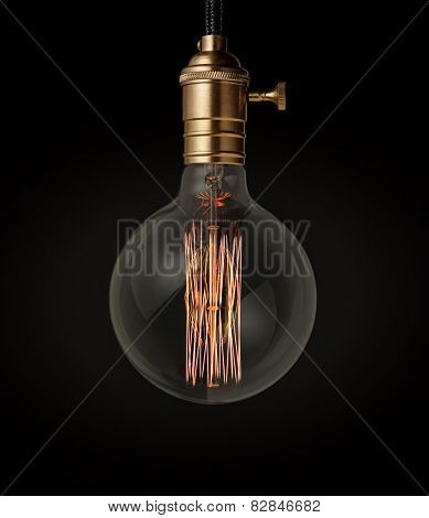 Edison light bulb on black background