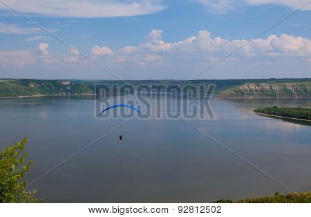 Paraglider Above Bakota Beautiful Reservoir In The Clouds