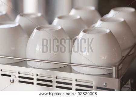 Empty coffee cup on coffee machine