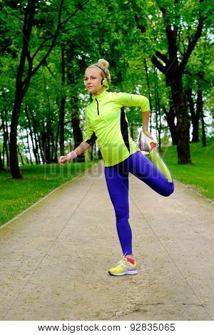 Woman doing stretching exercise before running 