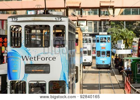 HONG KONG - JUNE 03, 2015: double-decker tram on street of HK. Hong Kong Tramways is a tram system in Hong Kong, being one of the earliest forms of public transport in the metropolis.
