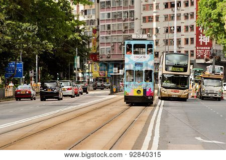 HONG KONG - JUNE 03, 2015: double-decker tram on street of HK. Hong Kong Tramways is a tram system in Hong Kong, being one of the earliest forms of public transport in the metropolis.