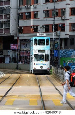 HONG KONG - JUNE 03, 2015: double-decker tram on street of HK. Hong Kong Tramways is a tram system in Hong Kong, being one of the earliest forms of public transport in the metropolis.
