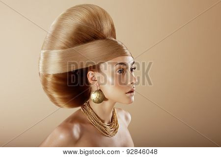 Styling. Profile Of Glamorous Woman With Golden Hairdo