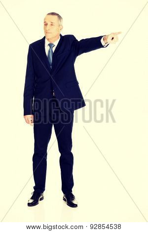 Full length boss dismissing someone.