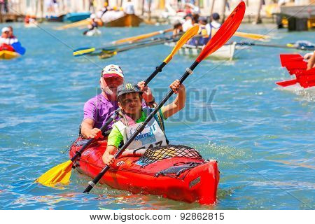 Oarsmen in the Venice Vogalonga regatta, Italy.