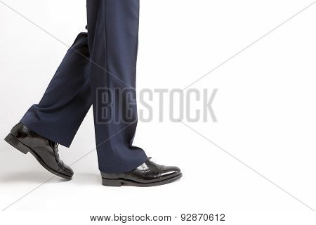 Footwear Concept: Closeup Of Stylish Black Shiny Male Semi-brogue Against White