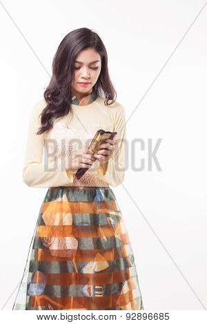 Beautiful Vietnamese Young Woman With Modern Style Ao Dai Holding A Paper Fan On White Background