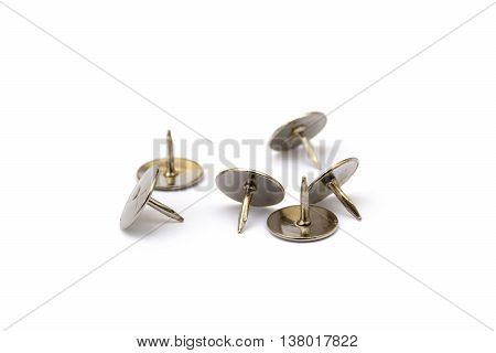 Ordered pile pushpins isolated on white background