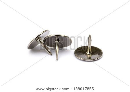 Ordered pile pushpins isolated on white background