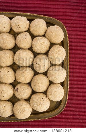Indian favourite sweet coconut laddu or laddoo or nariyal ladu