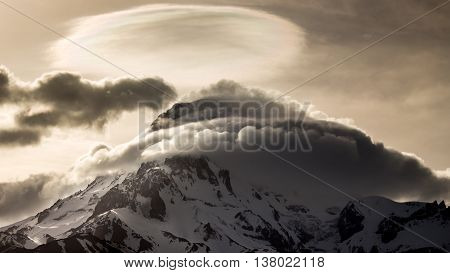 Snow peak of Mount Kazbek in the evening. Georgia.