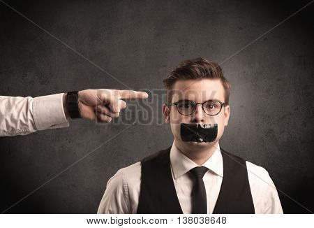 Caucasian business hand pointing at subordinate male employe