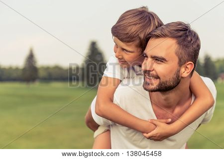 Dad And Son Resting Outdoors