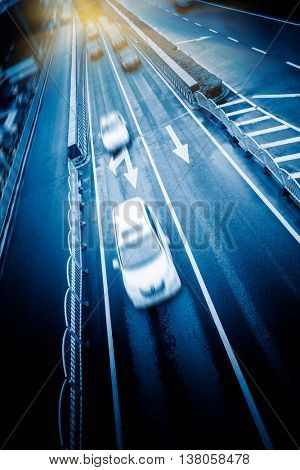 blurred car speeding on highway