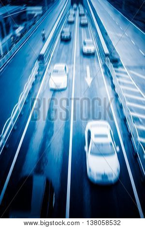 blurred car speeding on highway