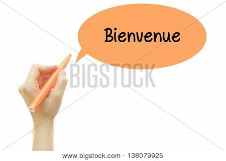Woman hand writing French Word Bienvenue (Welcome) message with a marker isolated on white.