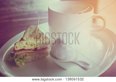 sandwich and the coffee on the disc