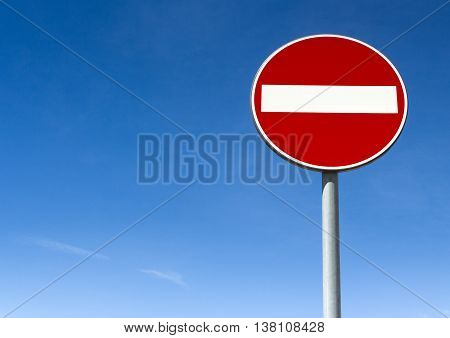 Road sign ban of access against the blue sky with copy space.