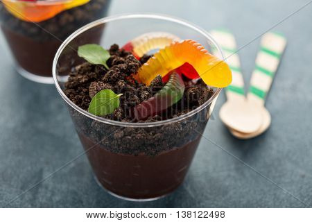 Children chocolate pudding dessert in a cup called dirt and worms