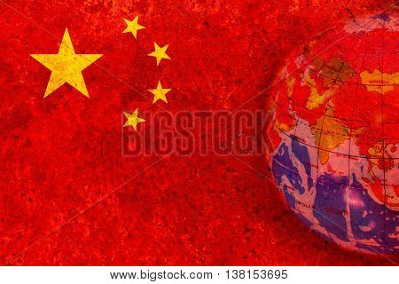 China - January 15 2015. globe in rustic chinese flag blackground