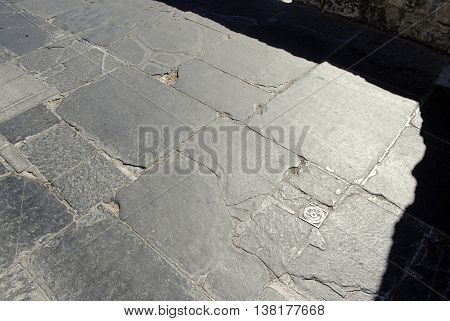 old granite paving  with an iron grip
