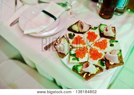 Elegance Wedding Reception Table With Food, Red Caviar On Butterbrot