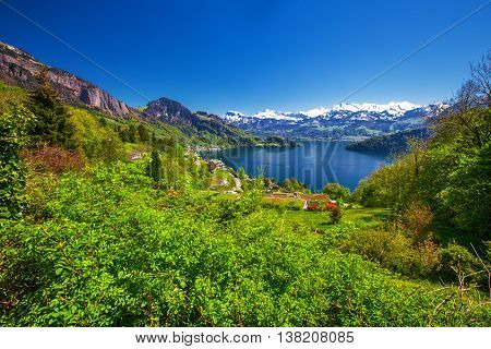 Panorama view to village Vitznau lake Lucerne (Vierwaldstattersee) and Swiss Alps near Luzern city Switzerland