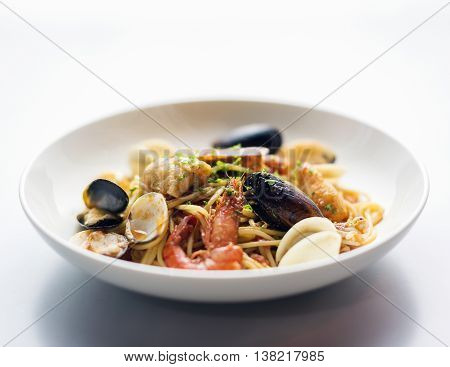 mussels shrimp and fish seafood and spicy tomato puttanesca marinara pasta