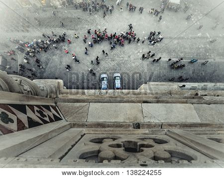 Florence tourists and police cars from Giotto's bell tower seen from above